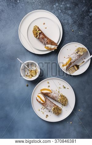 Traditional Italian Dessert Cannoli Siciliani On The Dark Background, Top View Image With A Copy Spa