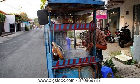 Indonesian Food, Mie Ayam, Noodles With Chicken Presented Directly By The Seller On The Cart, Unfocu