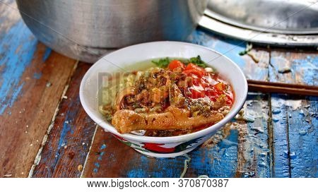 Indonesian Food, Mie Ayam, Noodles With Chicken Presented Directly By The Seller On The Cart, Unfocu