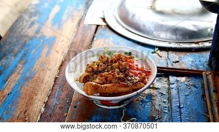 Indonesian Food, Mie Ayam, Noodles With Chicken Presented Directly By The Seller On The Cart, Unfocu
