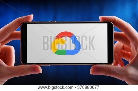 Poznan, Pol - May 21, 2020: Hand Holding Smartphone Displaying Logo Of Google Cloud Platform (gcp), 