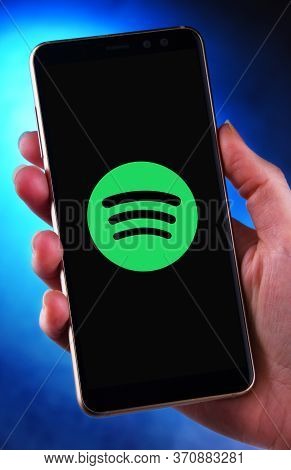 Poznan, Pol - May 21, 2020: Hand Holding Smartphone Displaying Logo Of Spotify, A Swedish Audio Stre