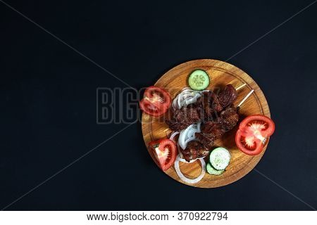 Shashlick And Cut Vegetables On Wooden Cutting Board On Black Background Flat Lay. Image Contains Co
