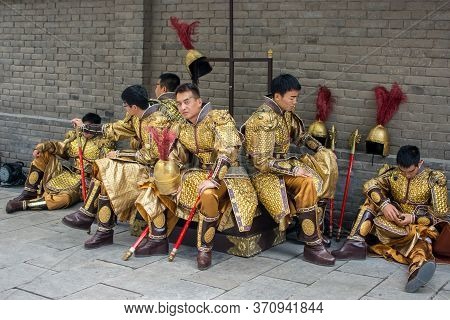 Xian / China - August 4th 2015: Group Of Men Dressed As Ancient Chinese Tang Dynasty Warriors In The