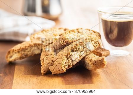 Sweet italian cantuccini cookies. Almonds biscuits on wooden table.