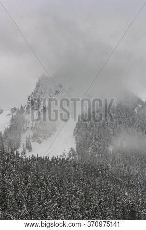 Stom Blows Over Pinnacle Peak In Winter