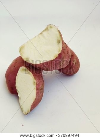 Broken Pink Color Sweet Potato Isolated In A White Background. This Is The Main Food In Pongal Or Ma