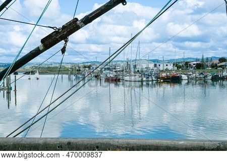 Napier New Zealand October 6 2010; View Through Rigging Of Fishing Boats Across Ahuriri Estuary To B