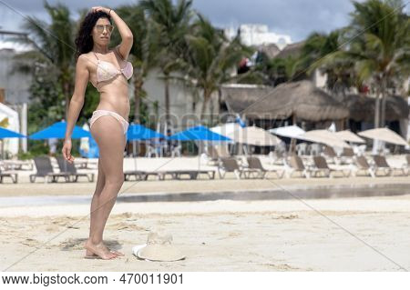 Beautiful Woman Relaxing In The Sun On The White Sandy Beach Of Playa Del Carmen In Mexico's Famous