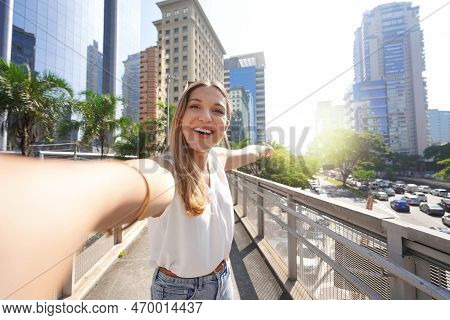 Travel In Sao Paulo, Brazil. Beautiful Smiling Girl Takes Self Portrait In Sao Paulo Sustainable Met