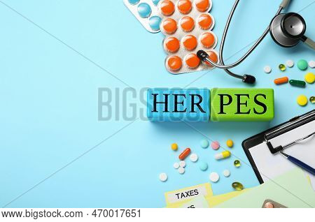 Word Herpes Made Of Colorful Cubes, Different Pills And Stethoscope On Light Blue Background, Flat L