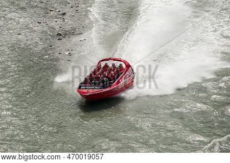 Shotover River, Queenstown, New Zealand - 20th December 2022: A Shotover Jetboat Full Of Passengers 