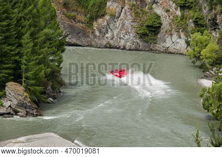 Shotover River, Queenstown, New Zealand - 20th December 2022: A Shotover Jetboat Full Of Passengers 