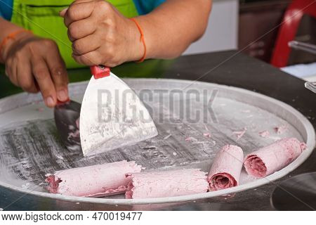 Woman Cooking Thailand Stir-fried Ice Cream Rolls At Freeze Pan. Organic, Natural Rolled Ice Cream, 
