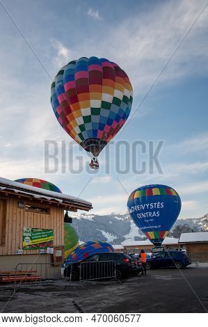 Chateau-d'oex,vaud, Switzerland - 23 January 2023: Hot Air Balloon Flying In The Sky. Hot Air Balloo