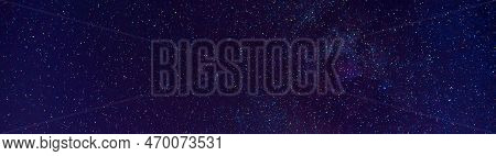 Astrophotography Of A Dark Blue Starry Sky With Many Stars, Nebulae And Galaxies. Panoramic Wide Hor