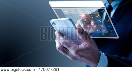 A Man His Left Phone Displayed Appointment Reminder For Calendar As Well As The Organizer's Agenda. 
