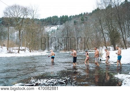 Vilnius, Lithuania - February 03 2023: Group Of People Going To Ice Bathing Together In The Cold Wat