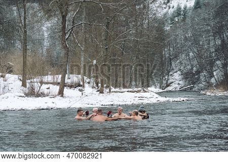 Vilnius, Lithuania - February 03 2023: Group Of People In Circle Ice Bathing Together In The Cold Wa