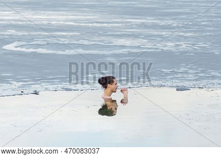 Vilnius, Lithuania - February 03 2023: Handsome Boy Or Man Ice Bathing In The Cold Water Of A Lake. 