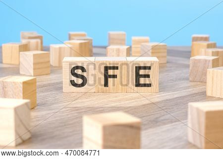 Sfe Text As Symbol On Cube Wooden Blocks.