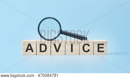 Wooden Cubes With Word Advice On Blue Background.