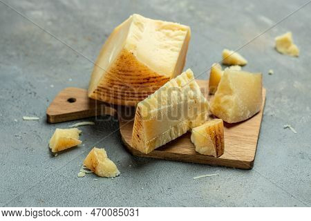Traditional Gravyer Gruyere Cheese Hard Yellow Cheese Without Holes, With A Dark Crust And A Pleasan