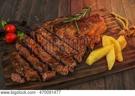 Veal Cutlet From Avila, Spain With Potatoes And Vegetables Juicy And Tender