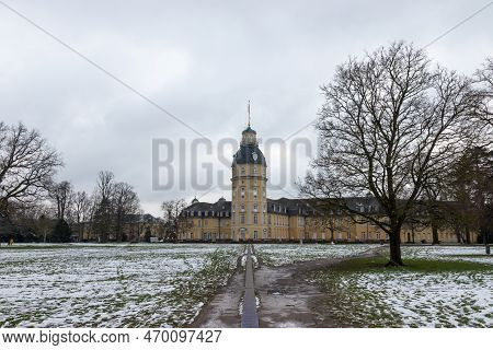 Karlsruhe Schloss Palace Seen From The Read Castle Garden After A Snowy Winter Day.