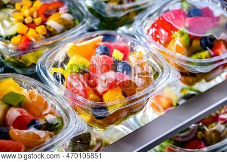 Boxes With Pre-packaged Fruit Salads In A Commercial Fridge