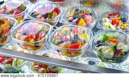Boxes With Fruit And Vegetable Salads In A Commercial Fridge