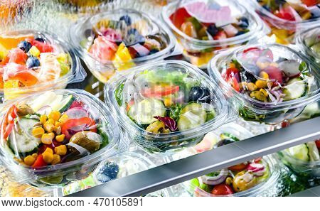 Boxes With Fruit And Vegetable Salads In A Commercial Fridge