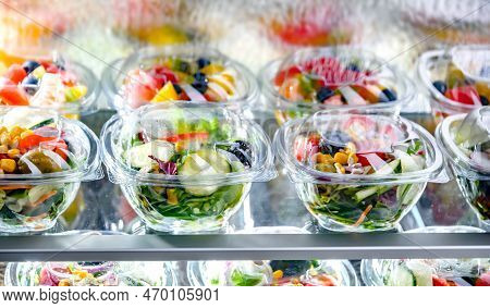 Boxes With Fruit And Vegetable Salads In A Commercial Fridge