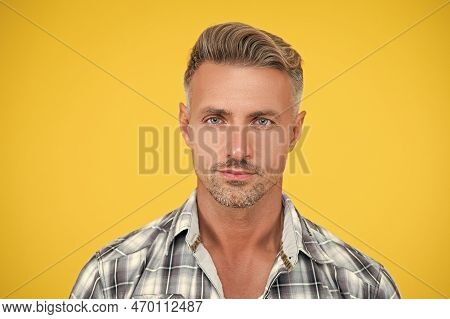Mature Man With Grizzle Hair On Yellow Background