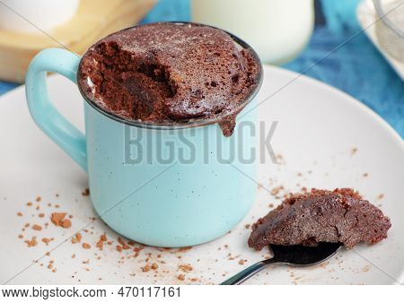 Mugcake Is Microwaved. Homemade Cupcake In A Mug Is On A Plate.
