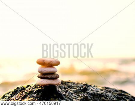 Stack Pebbles On Stone With Blur Sea And Overlight Sunset Background,design Nature Buddhism Therapy 