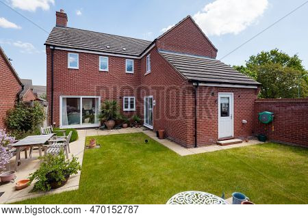 Longstanton, Cambridgeshire, England - May 16 2019: Typical Landscaped Garden Space On Modern Housin