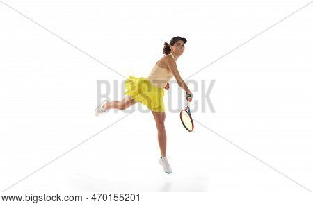 Studio Shot Of Professional Young Female Tennis Player In Sports Uniform Training With Tennis Racket
