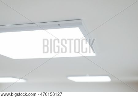 Ceiling Of Modern Office. Turned On Led Light Panels On The Ceiling