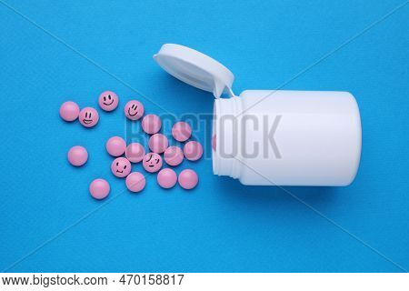 Pink Antidepressants And Medical Bottle On Light Blue Background, Flat Lay