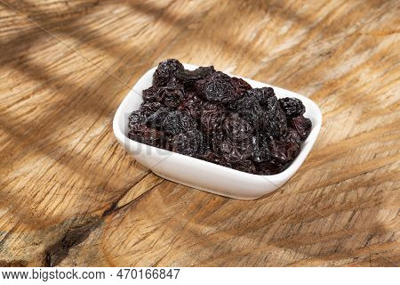 Healthy Food - Nuts Dehydrated Grapes; Photo On Wooden Background