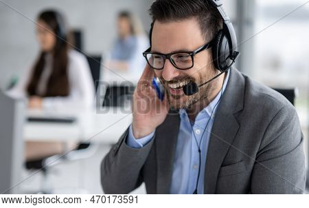 Closeup Head Shot Of Confident Bearded Call Center Operator Talking And Listening To Customer While 