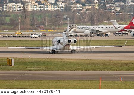 Zurich, Switzerland, January 20,2023 Dessault Falcon 7x Business Aircraft Is Taxiing To Its Takeoff 