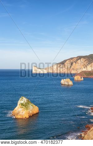 Rocky Cliffs On The Sea Coast. Sardinia, Italy. Nature Background