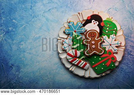 Christmas Gingerbread And Sugar Cookies Decorated With Royal Icing On A Plate With Copy Space