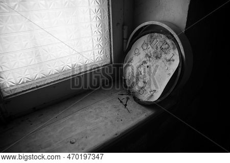 Old And Vintage Blank Clock Dial Without Hand On Old Wooden Table