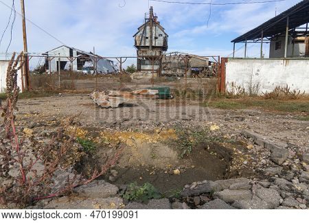 Countryside. Destroyed After The Shelling Of The Farm. In The Foreground Is The Crater From The Expl