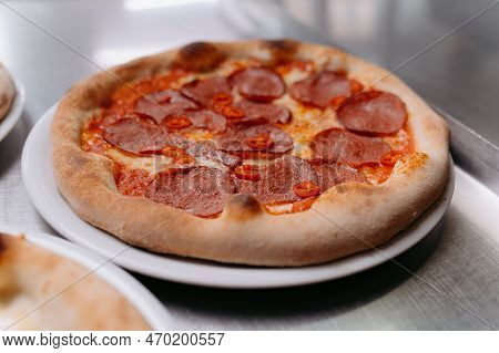 Pizza With Sausage And Pepper With Tomato Sauce