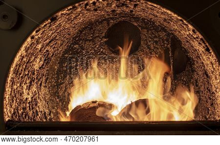 Tar Deposit Inside The Wood Fuel Boiler. Shinny Black Deposit Inside The Solid Fuel Boiler. Creosote