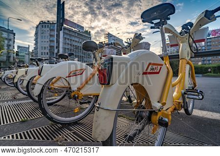 Milan, Italy - 09 10 2020: Bike Sharing Rack In A Square In City Center Of Milan, Italy. Time Lapse.